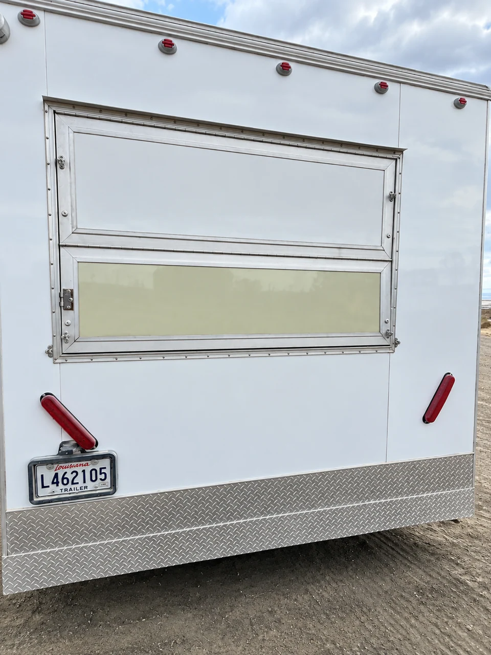 Mobile kitchen trailer exterior with a service window